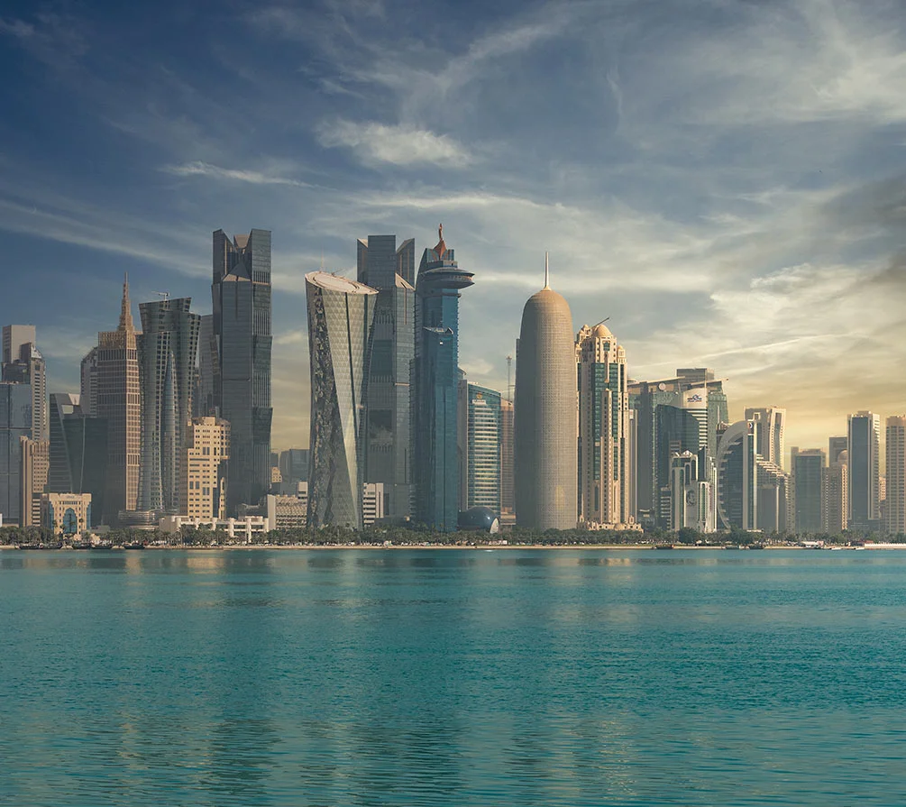 Skyline of Doha with skyscrapers by the water.
Al Sulaiti Law Firm